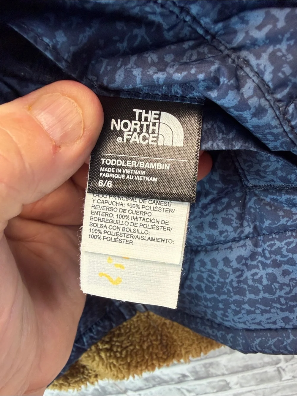 The North Face Kids Navy Blue Quilted Puffer Jacket with Sherpa Hood reversible